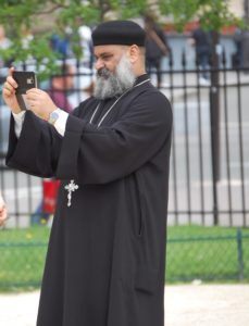 Made me happy to see the priest taking a selfie with Notre Dame!